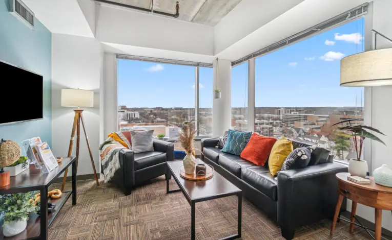 furnished student apartment living room with a TV
